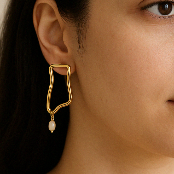Abstract pearl drop earrings in 925 sterling silver, modern elegant jewellery by Anushka Jain Jewellery